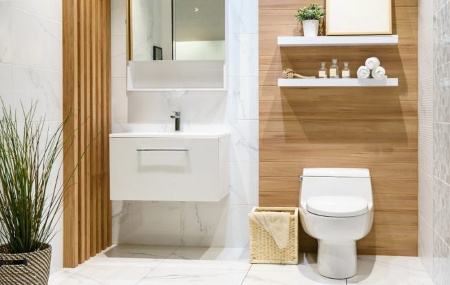 Modern spacious bathroom with bright tiles with toilet and sink — Expert Plumbers in Burleigh Heads, QLD