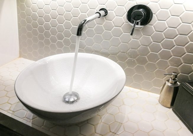 Modern hygienic wash basin with running clean water from tap faucet — Expert Plumbers in Coolangatta, QLD