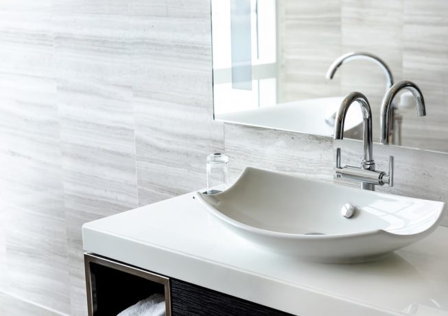 Luxury white porcelain sink on a bathroom table — Expert Plumbers in Robina, QLD