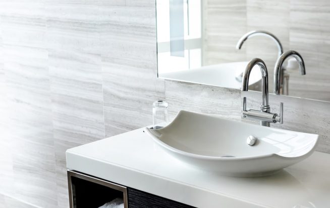 Luxury white porcelain sink on a bathroom table — Expert Plumbers in Robina, QLD