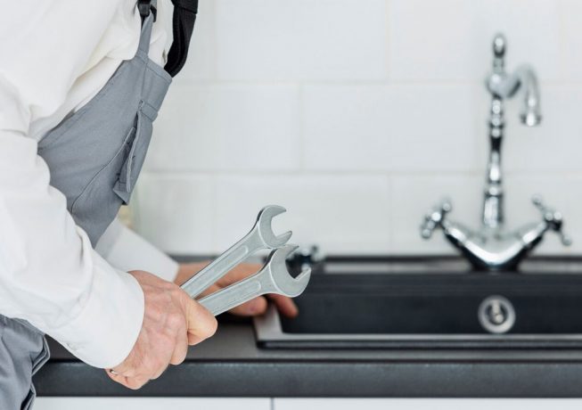 Close Up Plumber Working